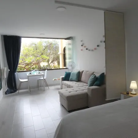Sweet White In Arona Apartment